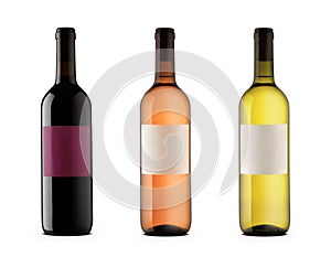 Three wine bottles with blank labels of red, rose and white wine