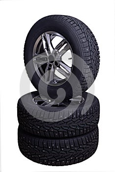 Three winter tires with spikes