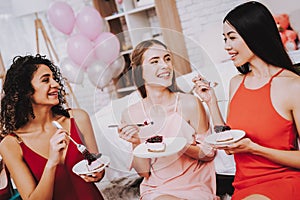 Three Women with Cake Celebrating Women`s Day.