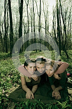 Three women in a forest