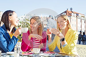 Three women having a fun conversation