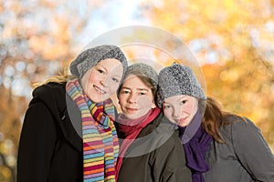 Three women leaning together october