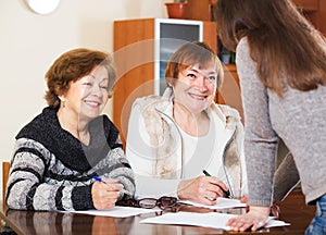 Three women with papers