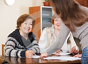 Three women with papers