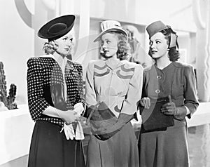 Three women standing side by side photo