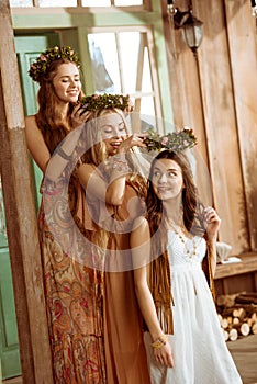Three women with wreaths