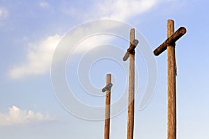 Three Wooden Crosses and Clouds photo