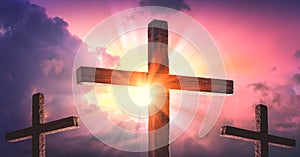 Three Wooden Crosses With Sunrise And Clouds photo