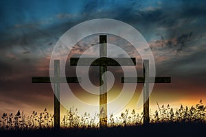 Three wooden Crosses at sunset