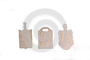 Three wooden cutting boards isolated on white background flat lay