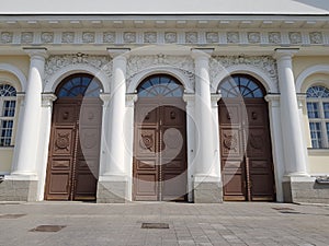 Three wooden doors in an old building