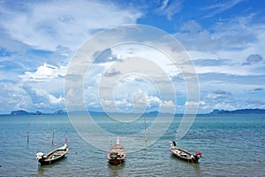 Three wooden empty boats