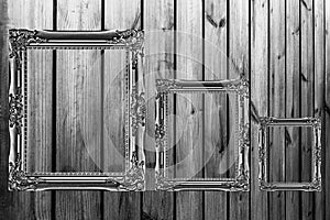 three wooden frames on wooden background