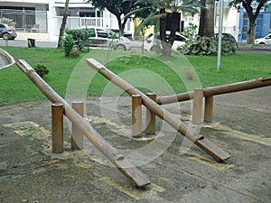 Three wooden seesaws for children in the middle of the square. photo