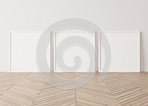 Three wooden square frames Standing on parquet floor with white background