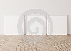 Three wooden square frames Standing on parquet floor with white background photo