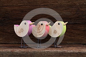 Three Wooden Toy Birds Decoration Rough Background