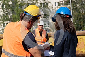 Three workers on construction site