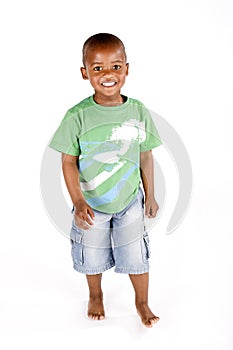 Three year old black boy standing and smiling photo