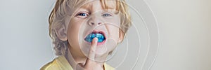 Three-year old boy shows myofunctional trainer to illuminate mouth breathing habit. Helps equalize the growing teeth and