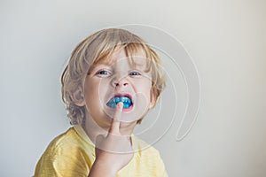 Three-year old boy shows myofunctional trainer to illuminate mouth breathing habit. Helps equalize the growing teeth and correct b