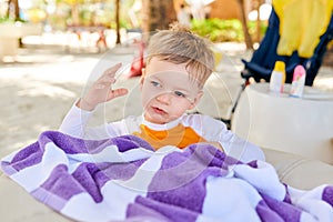 Three year old toddler boy on beach