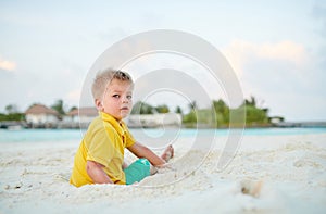 Three year old toddler boy on beach