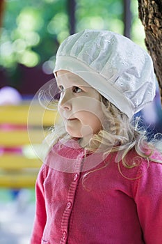 Three years old girl portrait wearing white broderie anglaise fabric beret photo