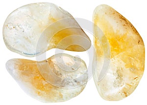 Three yellow citrine gemstones isolated on white