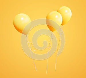 Three yellow party balloons