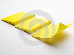 Three yellow post-it notes isolated on white background