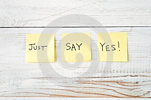 Three Yellow Post It notes with Message Just Say Yes!