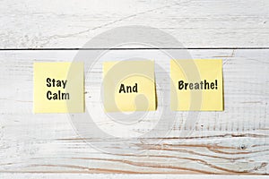 Three Yellow Post It notes with Message Stay Calm and Breathe!