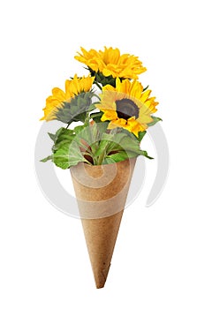 Three yellow sunflowers in a craft paper corner isolated