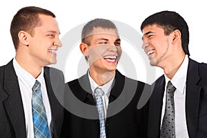 Three young businessmen laugh