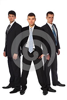 Three young businessmen stand semicircle photo