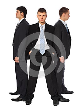 Three young businessmen stand semicircle