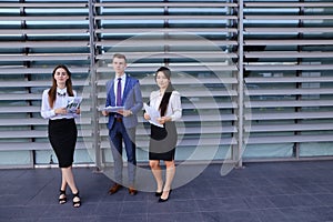 Three young entrepreneur modern, educated students, guy and two