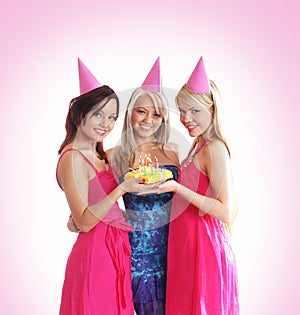 Three young girls are celebrate a birthday party