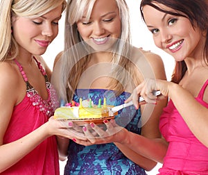 Three young girls are having a birthday party