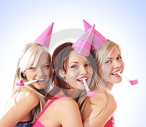 Three young girls are having a birthday party