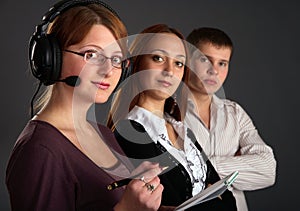 Three young happy and successful businesspeople