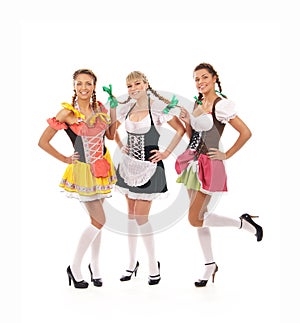 Three young and happy women in Bavarian clothes