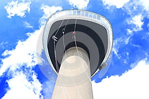 Three young People abseiling down the Euromast tower in Rotterdam