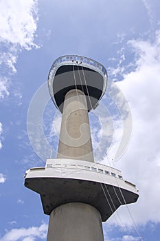 Three young People abseiling down the Euromast tower in Rotterdam