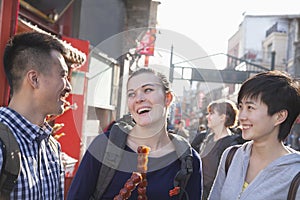 Three young people with candied haw.