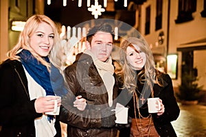 Three young People drinking Punch