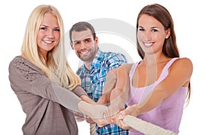 Three young people pulling rope