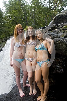 Three young woman at waterfall