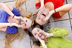 Three young women shouting